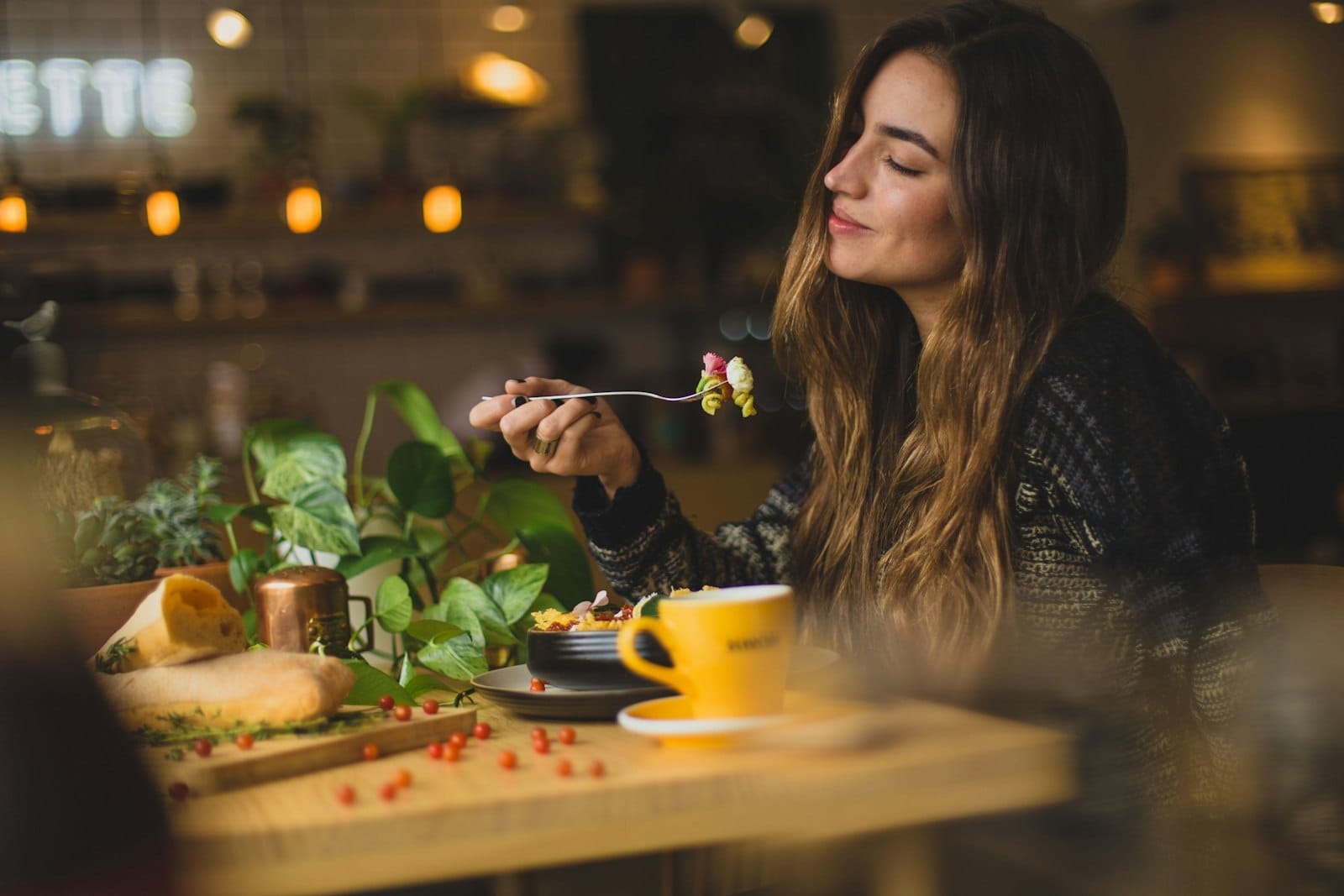 A happy diner enjoying a plant-based meal