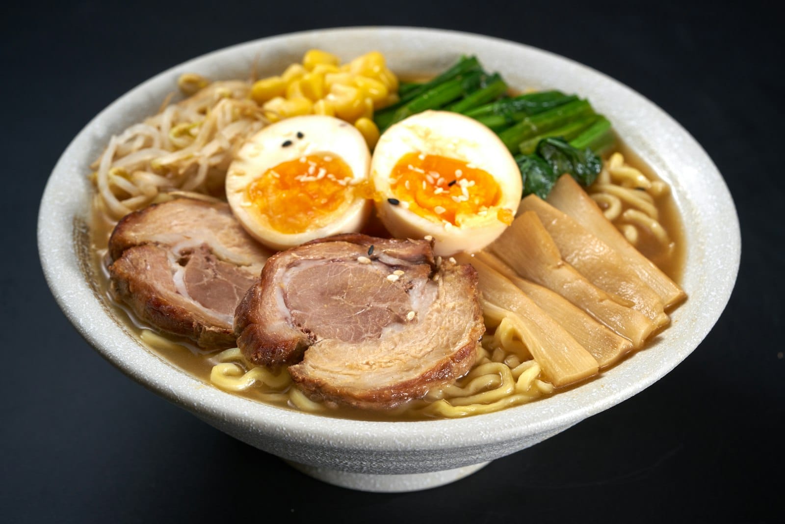 A bowl of ramen with broth and noodles